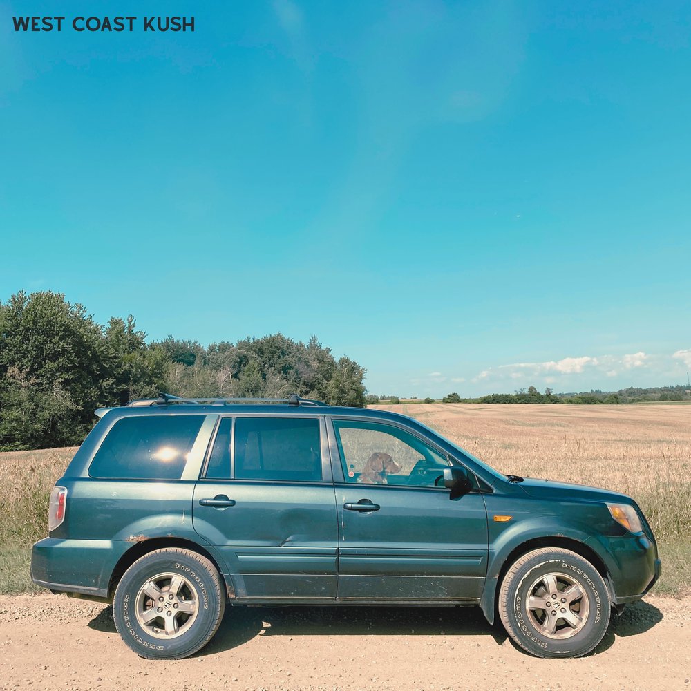 West Coast Kush single cover by Lee Watson: a green SUV with a dog in the driver's seat on a gravel road